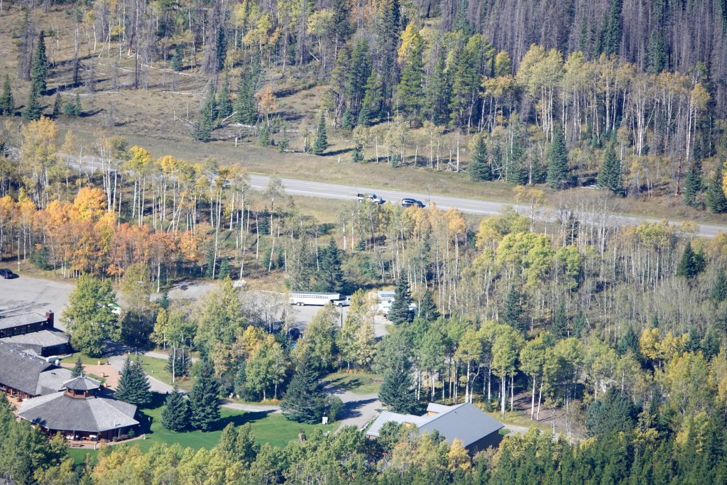 Boundary Ranch from Old Baldy West Ridge, cars parked at the side of highway 40